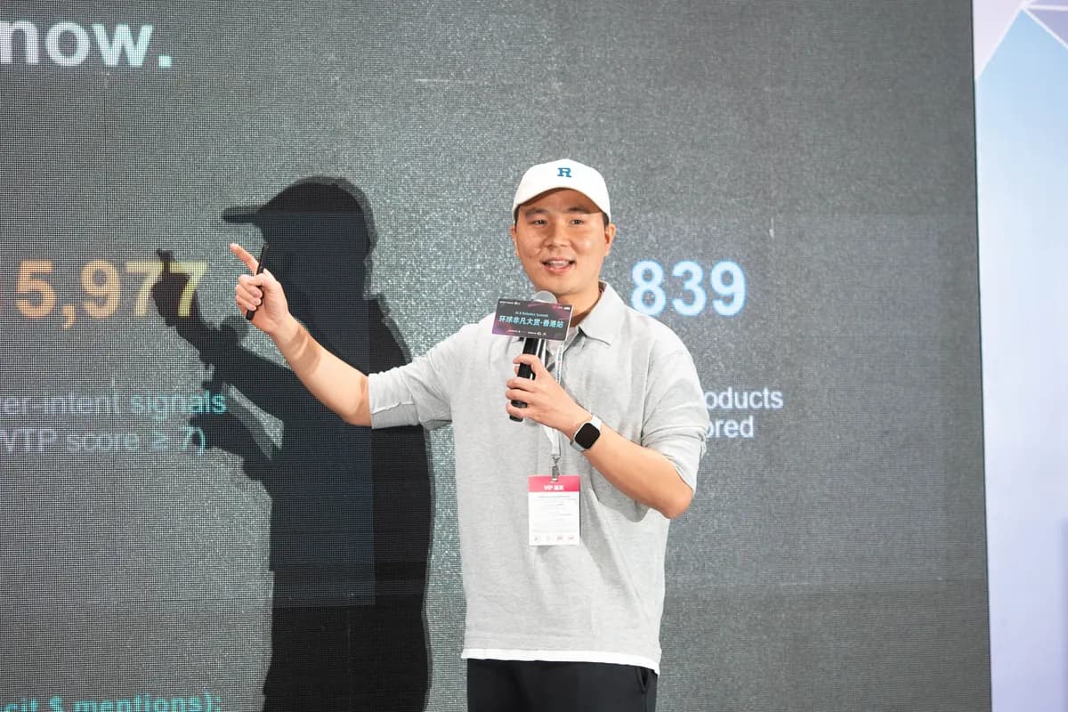 Bill demonstrating PainHunt product data live on stage at HK AI Summit 2026