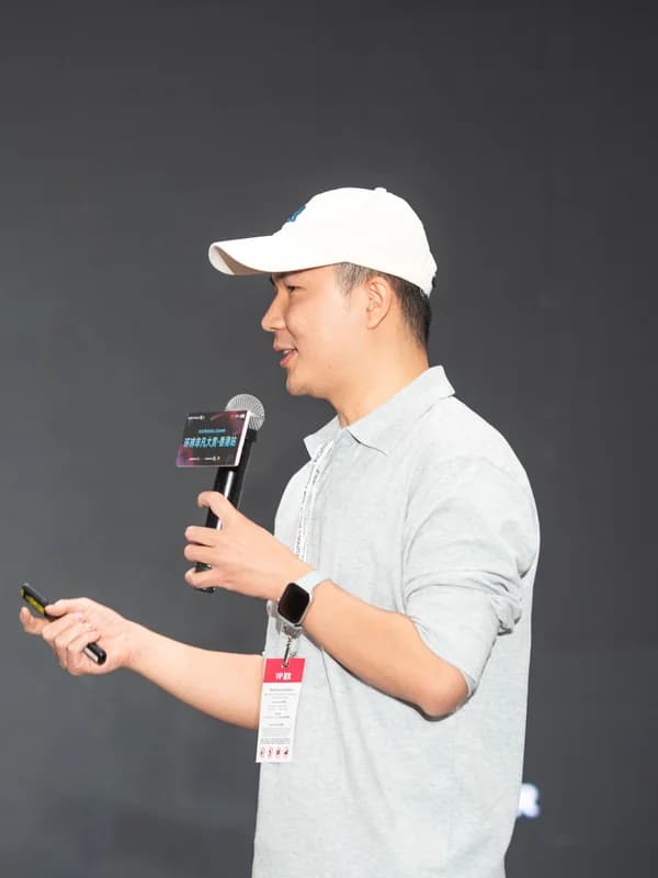 Bill Li speaking on stage at HK AI Summit 2026